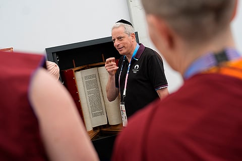 Rabbi Moshe Lewin shows the Torah